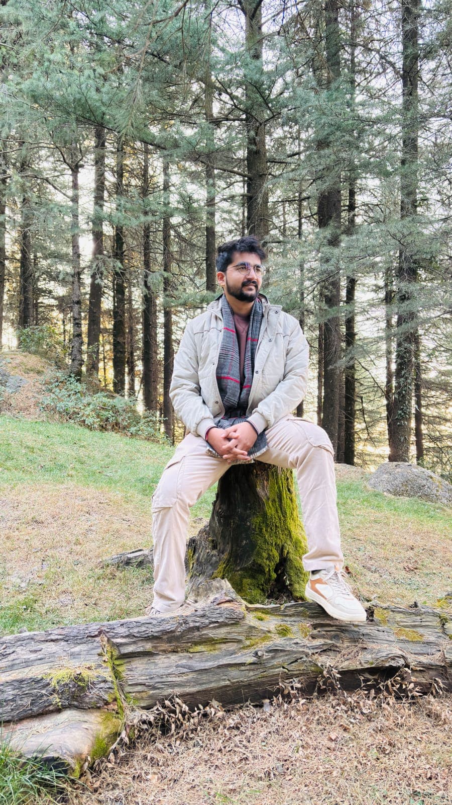Manish Jangir sitting outdoors among trees